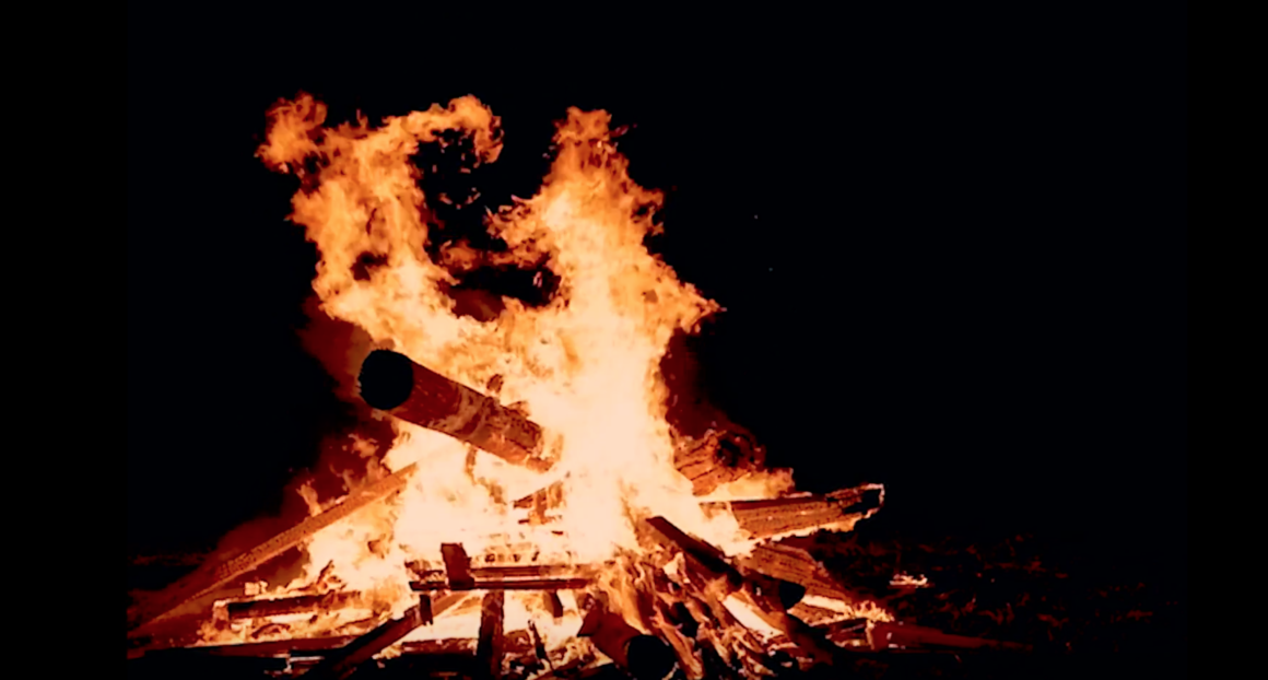 close up of logs burning at night